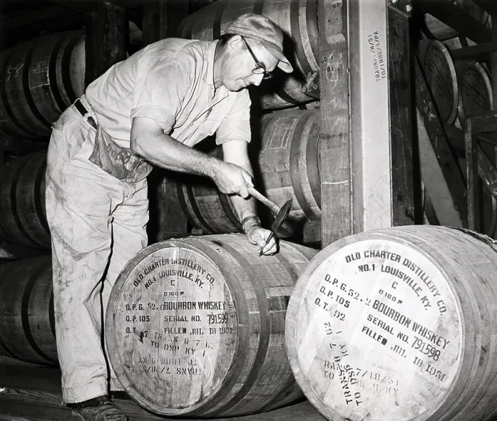 Framed Print : Distiller Plugging Whiskey Barrel Framed Print : Distiller Plugging Whiskey Barrel