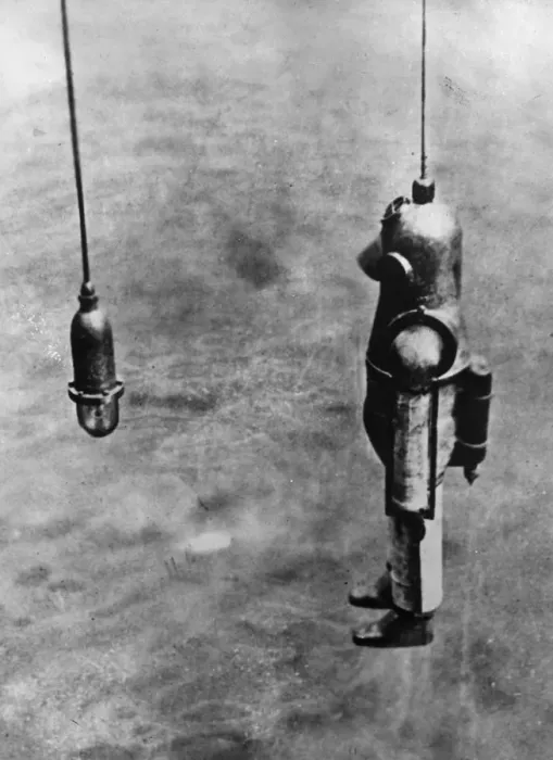 Framed Print : Diver. circa 1900: A diver goes down from the salvage ship Blakey to the Framed Print : Diver. circa 1900: A diver goes down from the salvage ship Blakey to the