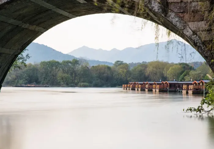 Framed Print : The dock seen from an arch of a stone bridge in Maojiabu Village, Hangzhou, China Framed Print : The dock seen from an arch of a stone bridge in Maojiabu Village, Hangzhou, China