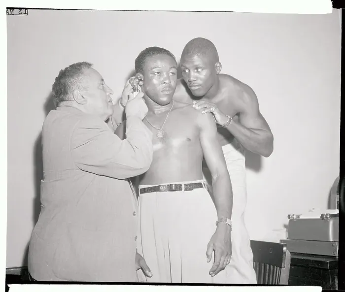 Framed Print : Doctor Checking Out Kid Gavilan's Ear Framed Print : Doctor Checking Out Kid Gavilan's Ear