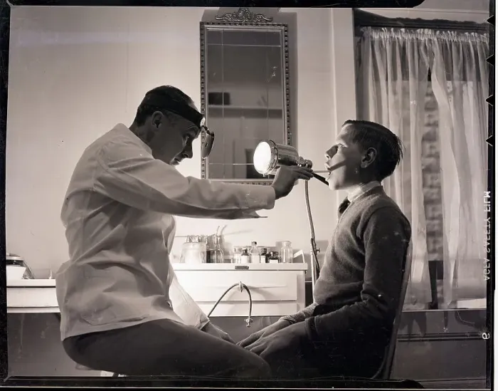 Framed Print : Doctor Examining Boy Patient Framed Print : Doctor Examining Boy Patient