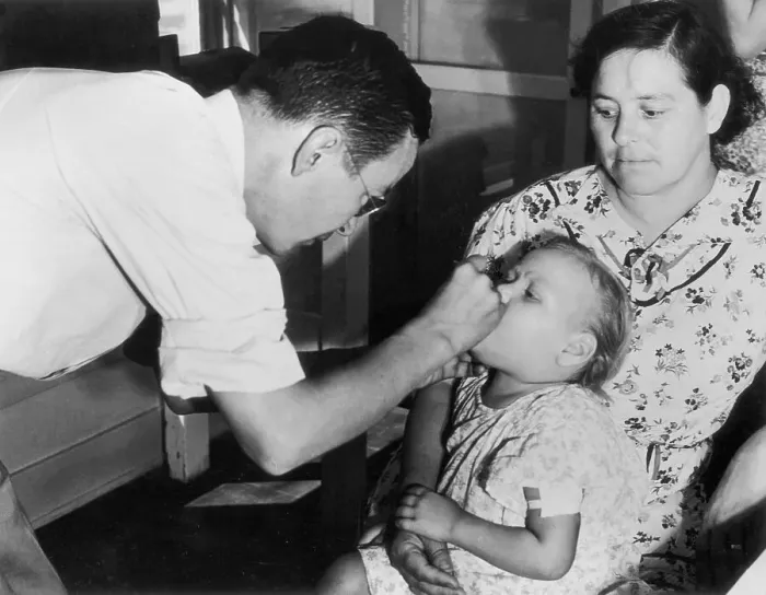 Framed Print : Doctor Examining a Child Framed Print : Doctor Examining a Child