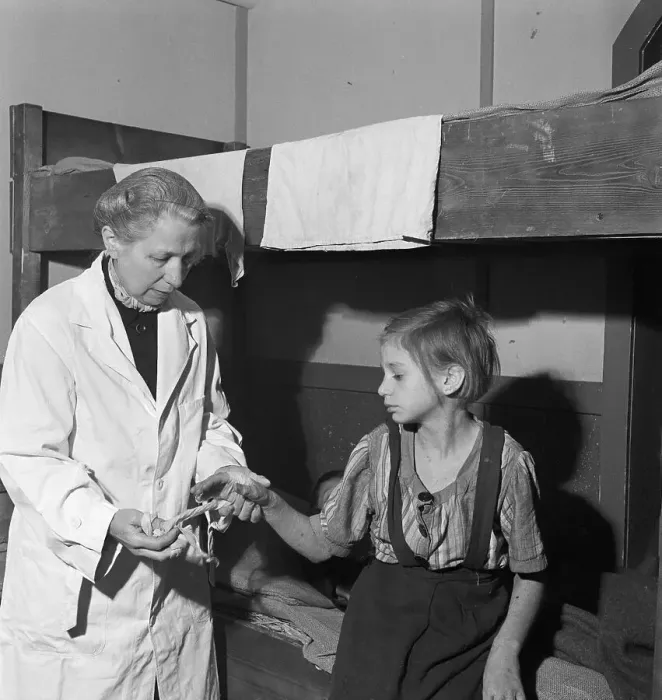 Framed Print : Doctor Examining Child in Postwar Camp