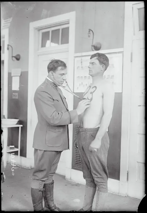 Framed Print : Doctor Examining Soldier on Base Framed Print : Doctor Examining Soldier on Base