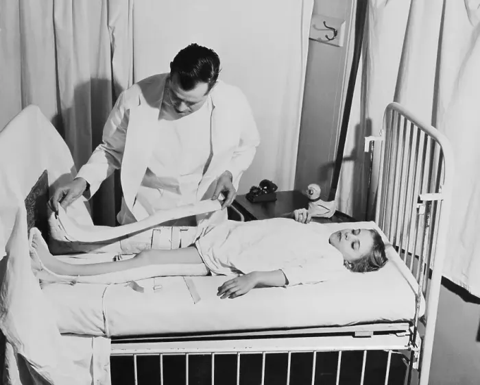 Framed Print : Doctor Examining Young Patient Framed Print : Doctor Examining Young Patient