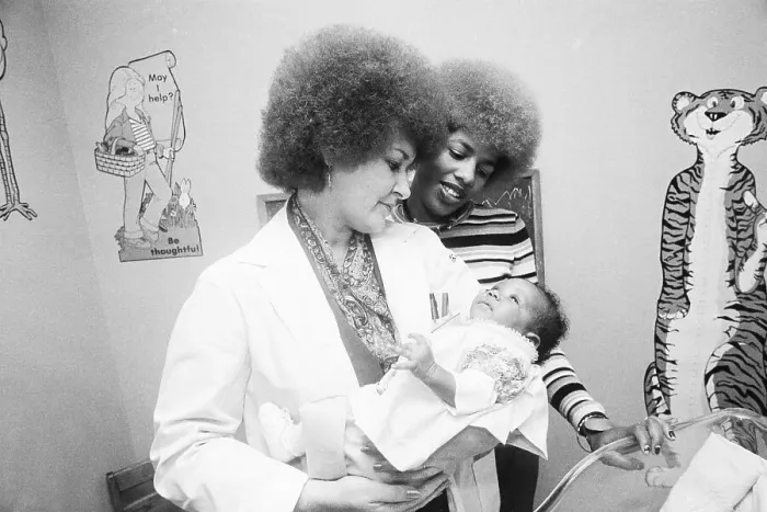 Framed Print : Doctor Loretta Finnegan with Addict Baby Framed Print : Doctor Loretta Finnegan with Addict Baby