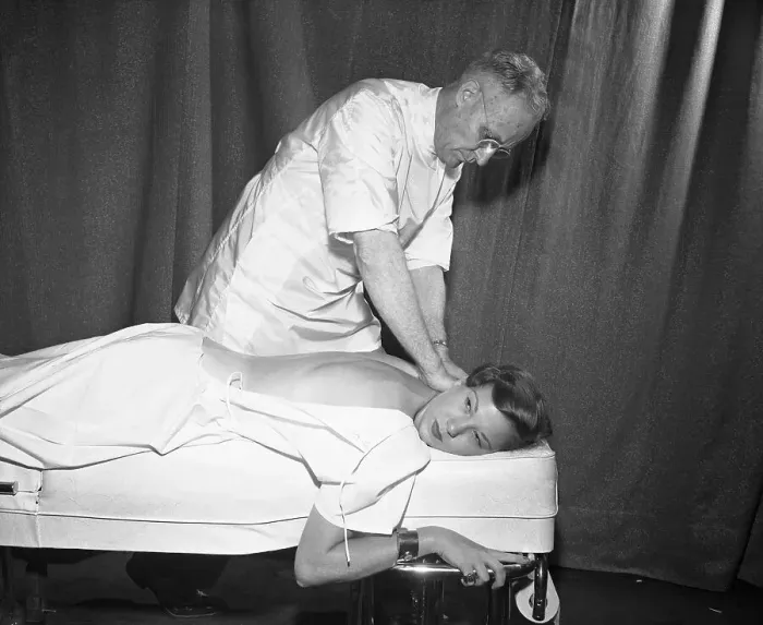 Framed Print : Doctor Massaging Women's Back Framed Print : Doctor Massaging Women's Back
