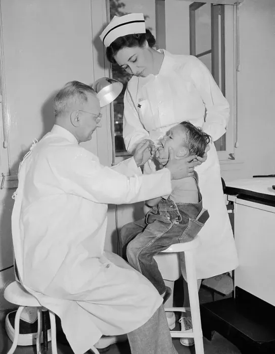Framed Print : Doctor and Nurse Examine Young Migrant Worker Framed Print : Doctor and Nurse Examine Young Migrant Worker