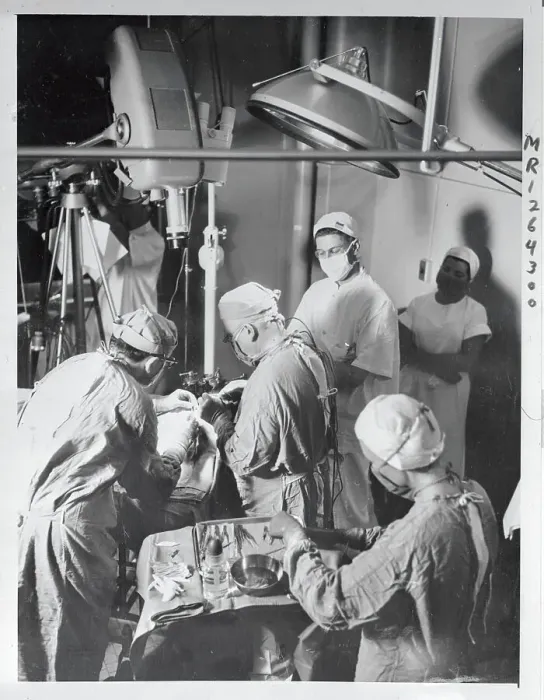 Framed Print : Doctor Performing Surgery Framed Print : Doctor Performing Surgery