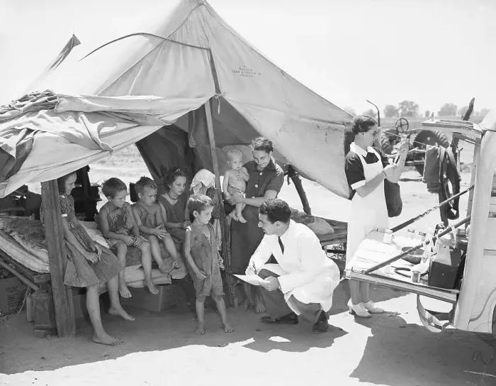 Framed Print : Doctor Talking to Children at Migrant Camps Framed Print : Doctor Talking to Children at Migrant Camps