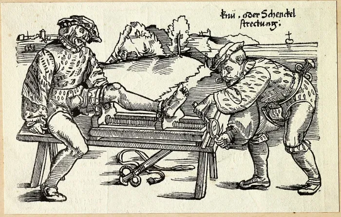 Framed Print : Doctor Treating Patient with Injured Leg Framed Print : Doctor Treating Patient with Injured Leg