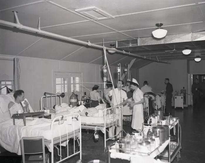 Framed Print : Doctors and Nurses Working with Patients Framed Print : Doctors and Nurses Working with Patients