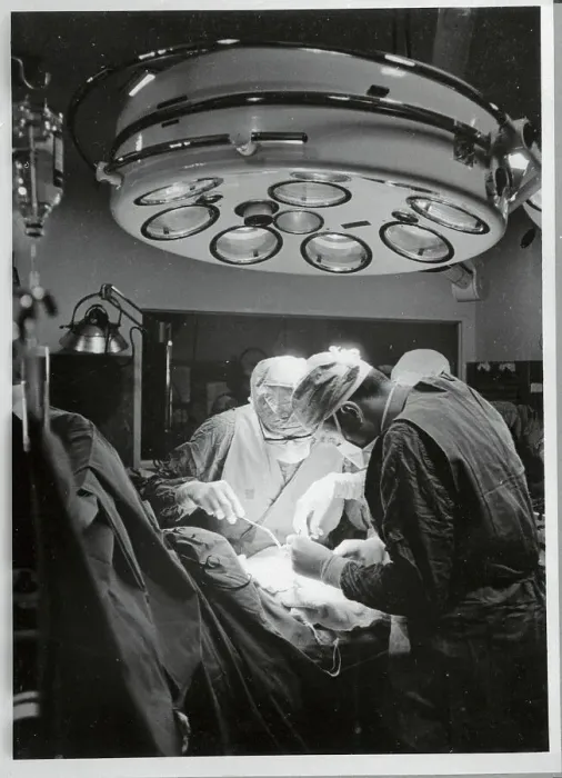 Framed Print : Doctors Performing Surgery in Operating Room Framed Print : Doctors Performing Surgery in Operating Room