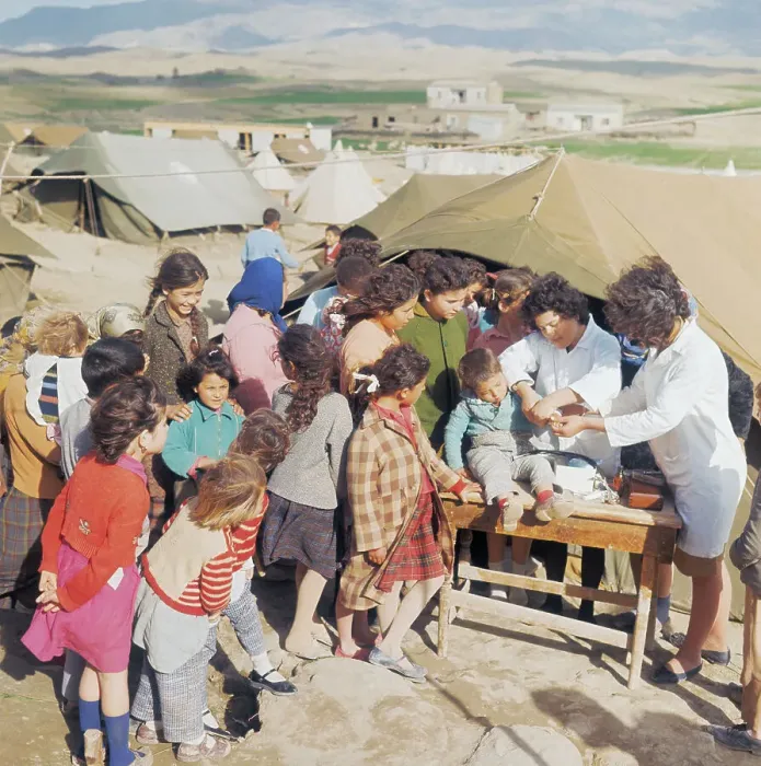 Framed Print : Doctors Treating Child at Turkish Refugee Camp Framed Print : Doctors Treating Child at Turkish Refugee Camp