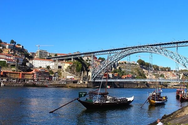 Dom LuAis I Bridge and a Rabelo boat in Porto