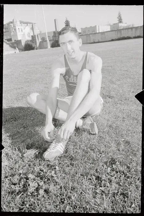 Framed Print : Don Bowden Sitting on Ground and Adjusting His Shoes Framed Print : Don Bowden Sitting on Ground and Adjusting His Shoes