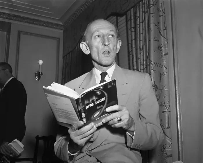Framed Print : Donald E. Keyhoe Holding UFO Book Framed Print : Donald E. Keyhoe Holding UFO Book