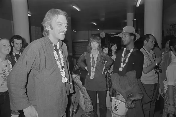 Framed Print : Donald Sutherland and Jane Fonda Standing with Others