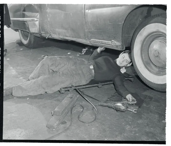 Framed Print : Doris Lang Working on a Car Framed Print : Doris Lang Working on a Car