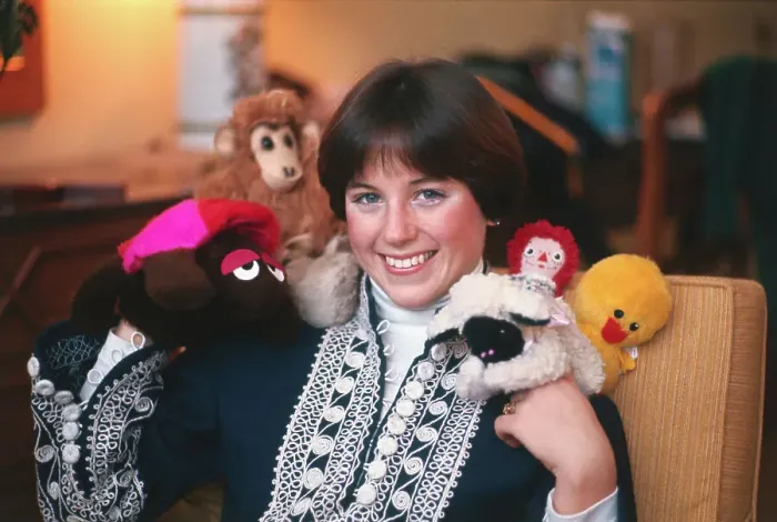 Framed Print : Dorothy Hamill Posing with Dolls Framed Print : Dorothy Hamill Posing with Dolls