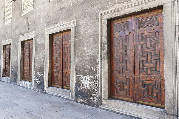 Four double doorways in a row along a wall at the blue mosque