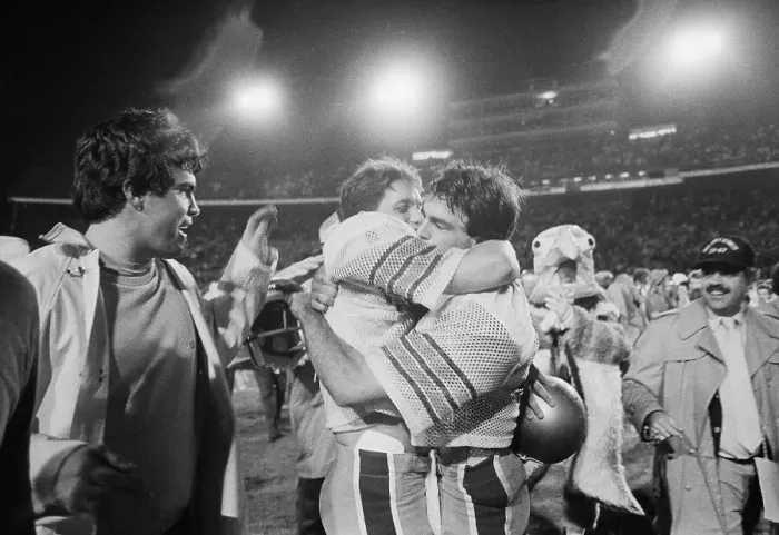 Framed Print : Doug Flutie Hugging Teammate Framed Print : Doug Flutie Hugging Teammate