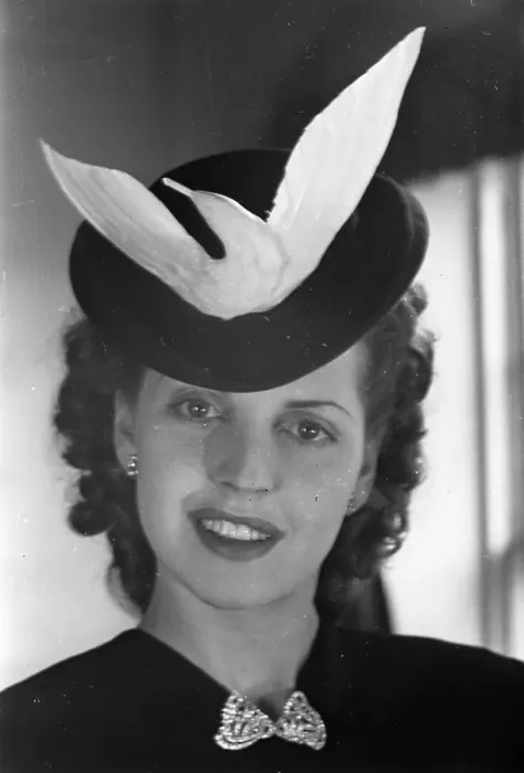 Framed Print : Dove Hat. A woman wearing a hat with a dove motif Framed Print : Dove Hat. A woman wearing a hat with a dove motif