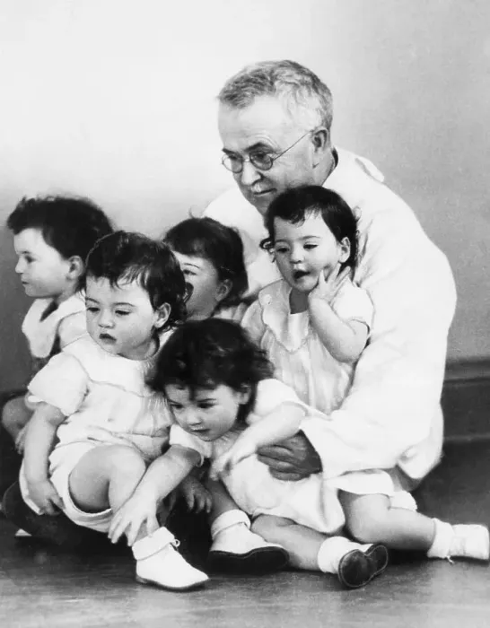 Framed Print : Dr. Allan Dafoe with the Dionne Quintuplets Framed Print : Dr. Allan Dafoe with the Dionne Quintuplets