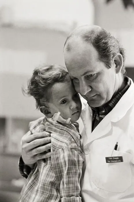 Framed Print : Dr Chiappe Holds 2 Yr.Old Volcano Victim
