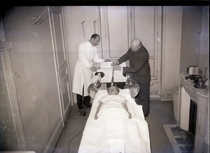 Framed Print : Dr. Gaetan Lievre Demonstrates Treatment Framed Print : Dr. Gaetan Lievre Demonstrates Treatment