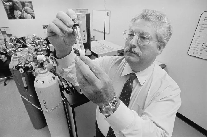 Framed Print : Dr. John Laseter Examining Test Tube Framed Print : Dr. John Laseter Examining Test Tube