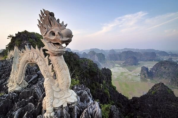 Dragon sculpture on a limestone hill, near Ninh Binh, Dry Halong Bay, Vietnam, Southeast Asia, Asia