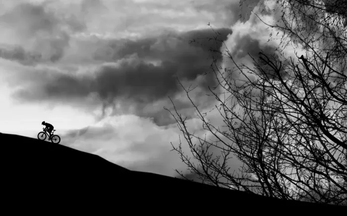 Framed Print : Dramatic cyclist climbing the mountain Framed Print : Dramatic cyclist climbing the mountain