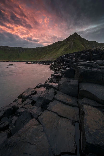 Dramatic sunrise at Giants Causeway in Northern Ireland