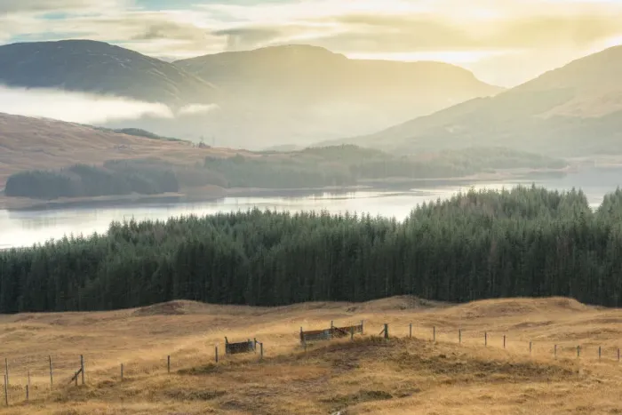 Framed Print : Dramatic sunset with atmospheric clouds over the mountainous Scottish landscape
