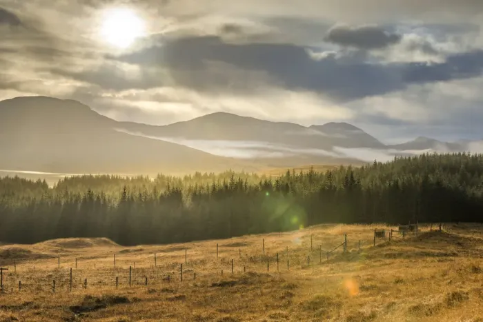 Framed Print : Dramatic sunset with atmospheric clouds over the mountainous Scottish landscape Framed Print : Dramatic sunset with atmospheric clouds over the mountainous Scottish landscape
