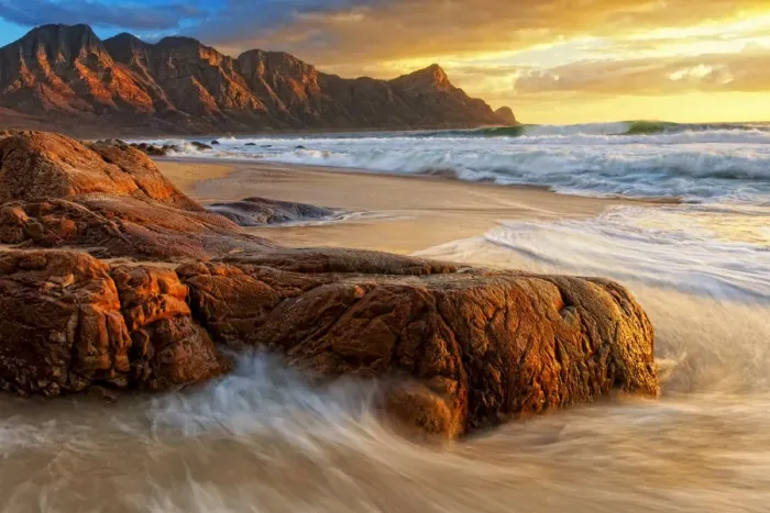 Framed Print : Dramatic Sunset over Kogel Bay in the Western Cape Province of South Africa with the Kogelberg Mountain Range forming a Stunning Backdrop Framed Print : Dramatic Sunset over Kogel Bay in the Western Cape Province of South Africa with the Kogelberg Mountain Range forming a Stunning Backdrop