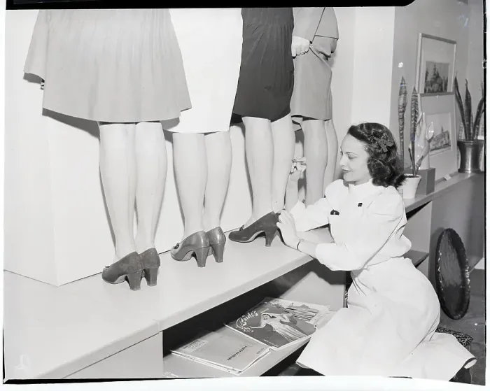 Framed Print : Drawing Fake Stocking Seams on Women's Legs Framed Print : Drawing Fake Stocking Seams on Women's Legs