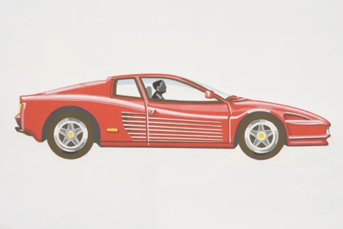 Framed Print : Driver in red coupe sports car, raised rear, low bonnet, side view Framed Print : Driver in red coupe sports car, raised rear, low bonnet, side view