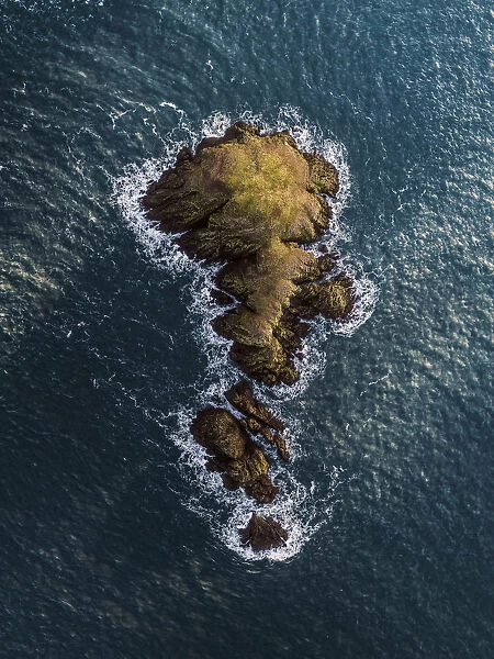 Drone view of a rock at sea, Fishguard, United Kingdom