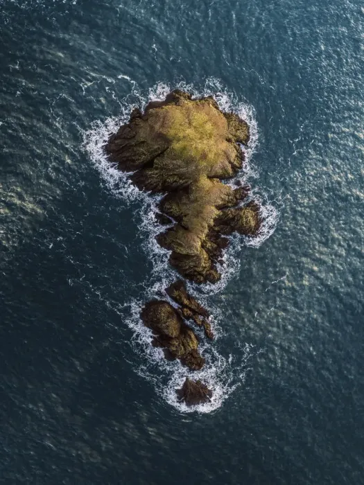 Framed Print : Drone view of a rock at sea, Fishguard, United Kingdom Framed Print : Drone view of a rock at sea, Fishguard, United Kingdom