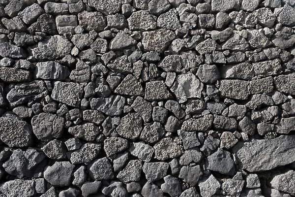 Dry wall constructed from individually stacked lava rocks, typical feature of Lanzarote, Lanzarote, Canary Islands, Spain