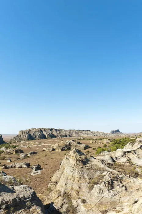 Framed Print : Dry and wide erosional landscape with rocks and trees, Isalo National Park, at Ranohira, Madagascar