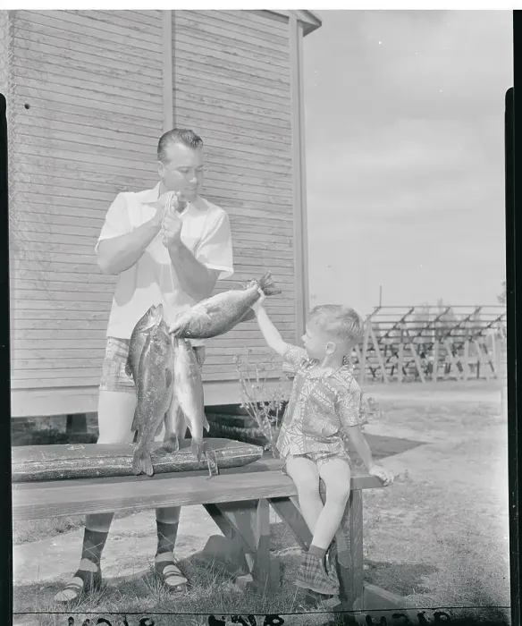 Framed Print : Duke and Kevin Snider Admiring Fish Framed Print : Duke and Kevin Snider Admiring Fish