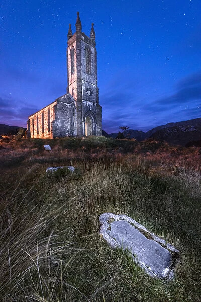 Dunlewy (Dunlewey) Old Church, Poisoned Glen, County Donegal, Ulster region, Ireland, Europe. Tombs in front of the old church at night