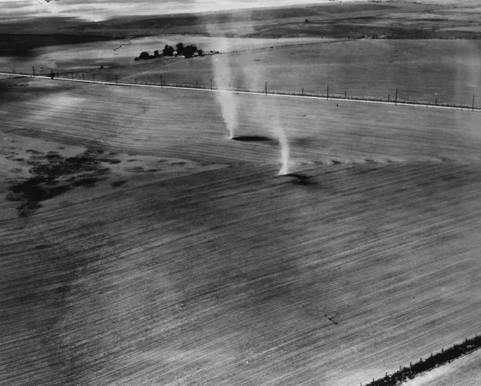 Framed Print : Dust Bowl. 16th July 1937: Early morning whirlwinds rising