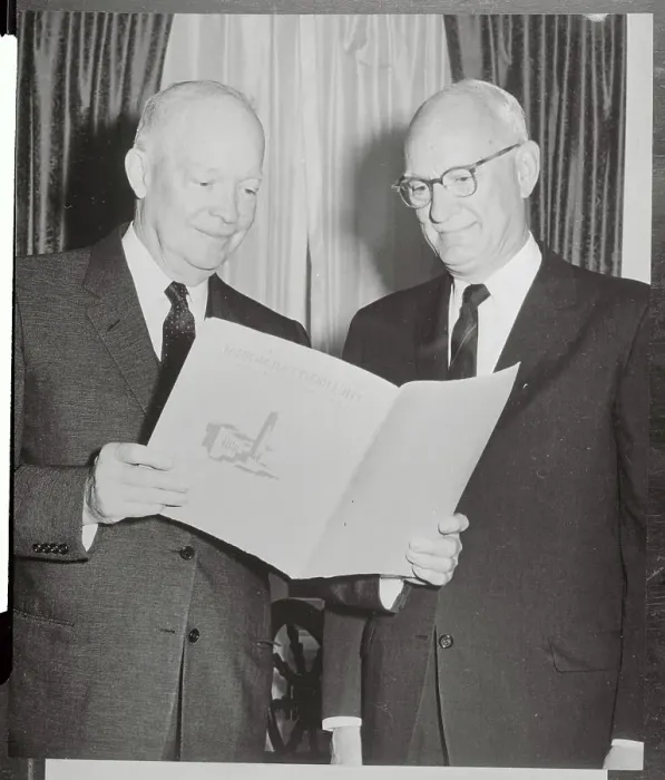 Framed Print : Dwight D. Eisenhower Reading Material with Businessman Framed Print : Dwight D. Eisenhower Reading Material with Businessman