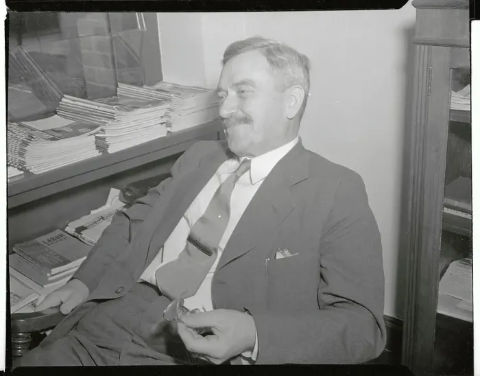Framed Print : Earl Browder Leaning Back in Chair and Holding Eyeglasses Framed Print : Earl Browder Leaning Back in Chair and Holding Eyeglasses
