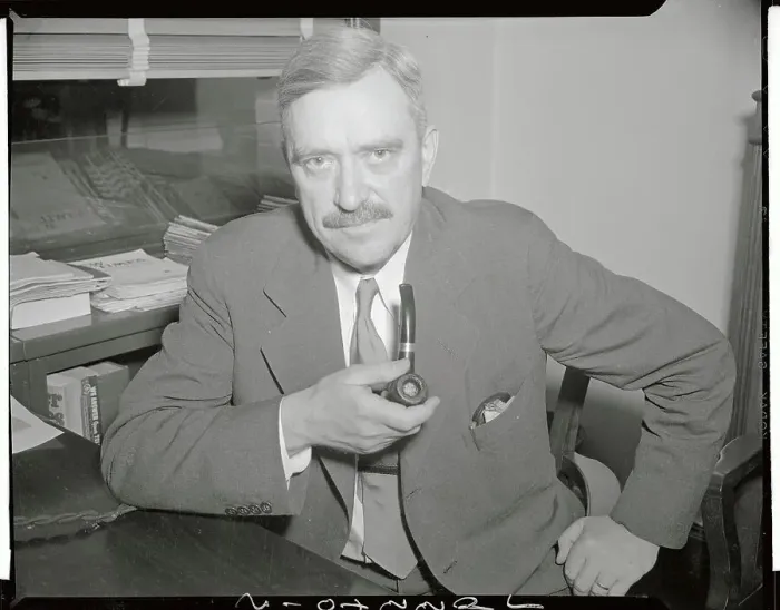 Framed Print : Earl Browder Posing with Pipe in Hand Framed Print : Earl Browder Posing with Pipe in Hand