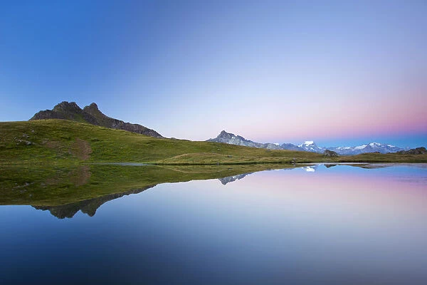 Early morning mood on Lake Berglimatt with a reflection of the Glarus Alps, Canton of Glarus, Switzerland, Europe